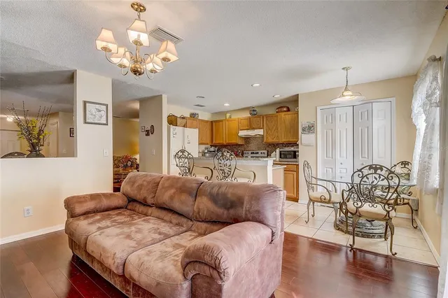 a view of a house with backyard porch and sitting area