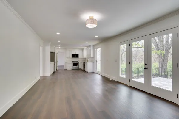 a view of kitchen with furniture and wooden floor