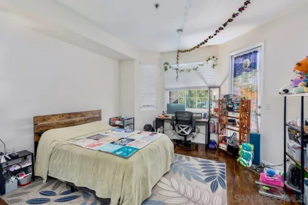 a bedroom that has a bed and a window