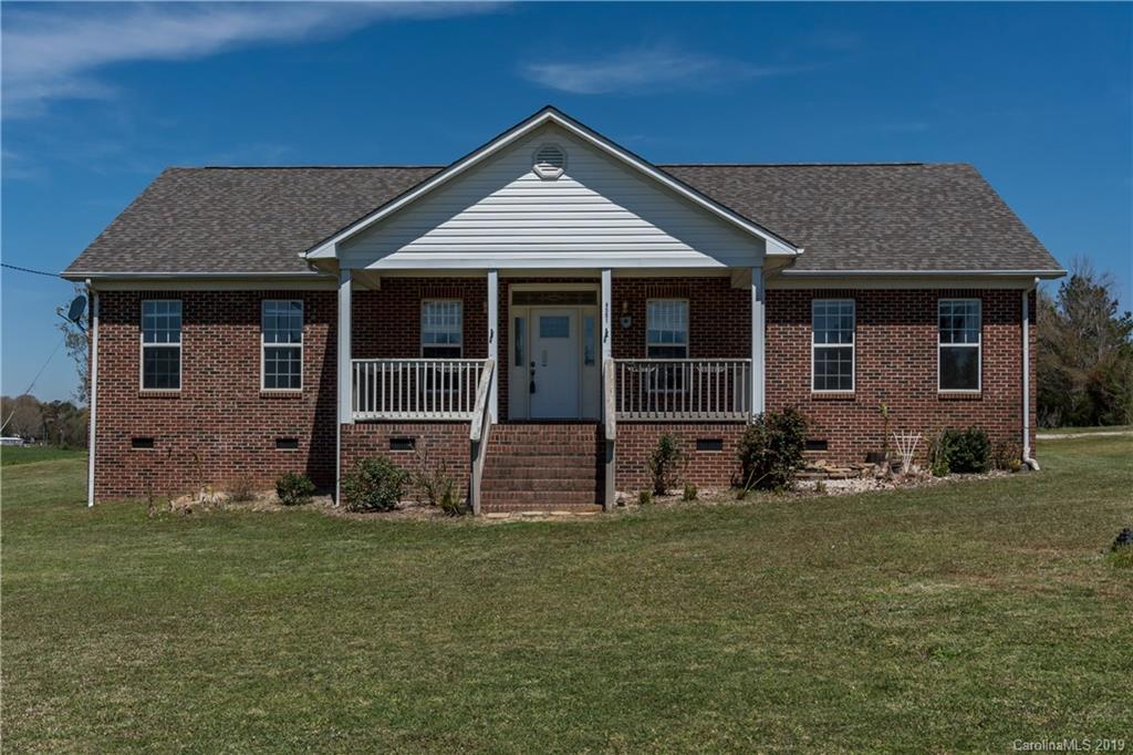 4501 Rowell Road Lancaster, SC 29720 - Photo 1 of 39 a front view of a house with a garden