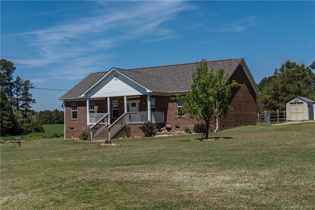 4501 Rowell Road Lancaster, SC 29720 - Photo 2 of 39 a front view of a house with a yard and trees