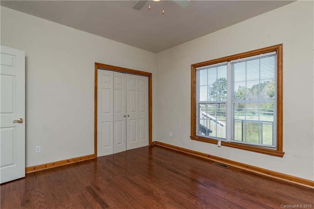 4501 Rowell Road Lancaster, SC 29720 - Photo 11 of 39 a view of an empty room with wooden floor and a window