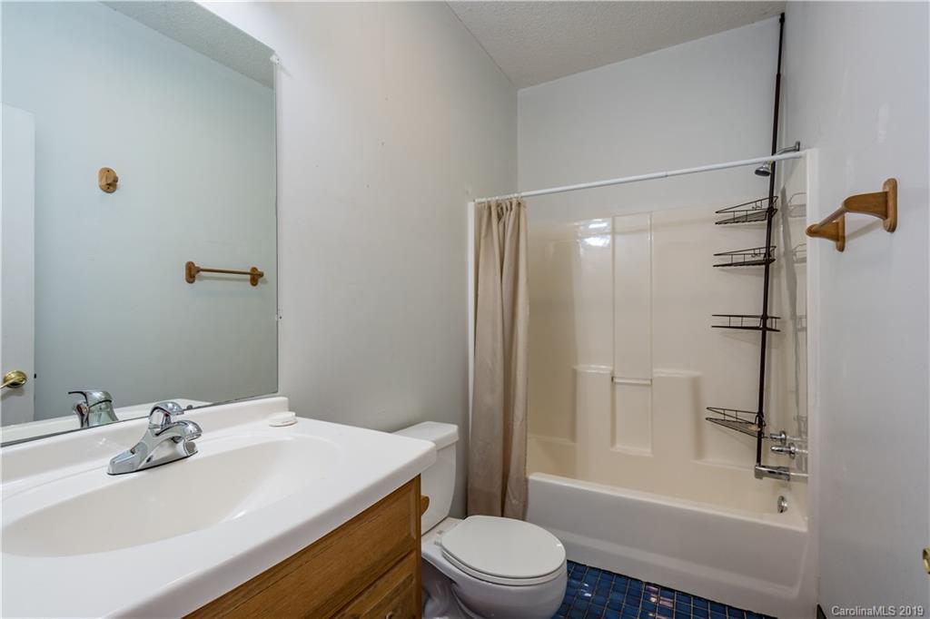 4501 Rowell Road Lancaster, SC 29720 - Photo 12 of 39 a bathroom with a sink toilet tub and shower