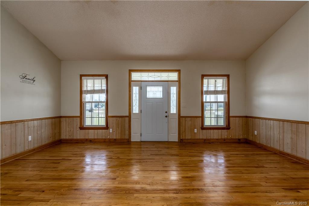 4501 Rowell Road Lancaster, SC 29720 - Photo 23 of 39 a view of an empty room with window and wooden floor