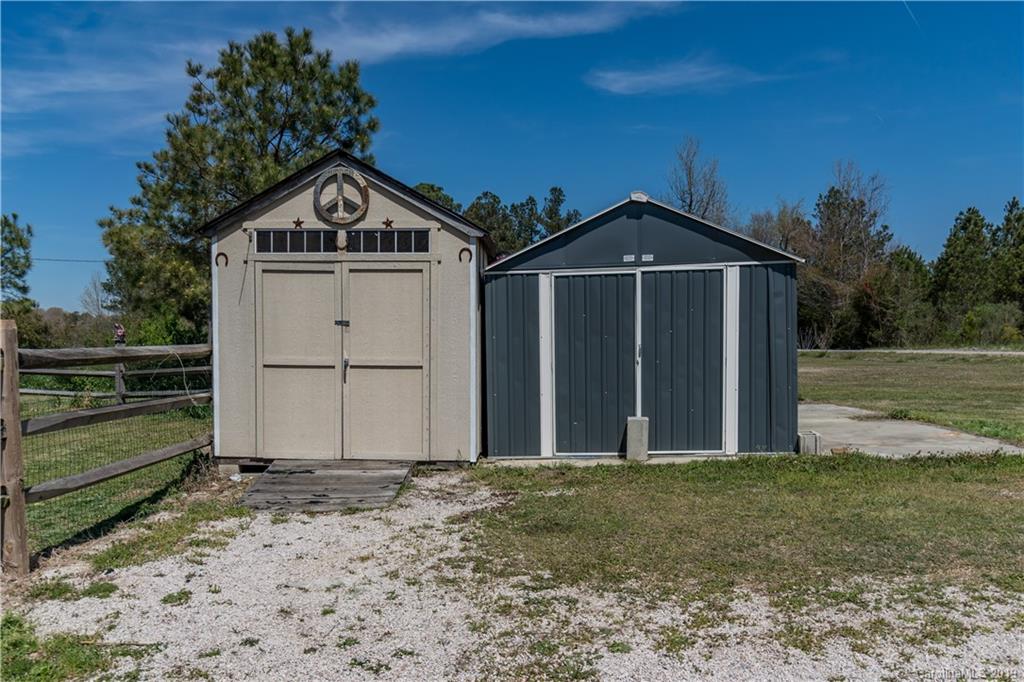 4501 Rowell Road Lancaster, SC 29720 - Photo 32 of 39 a view of a wooden house with a yard