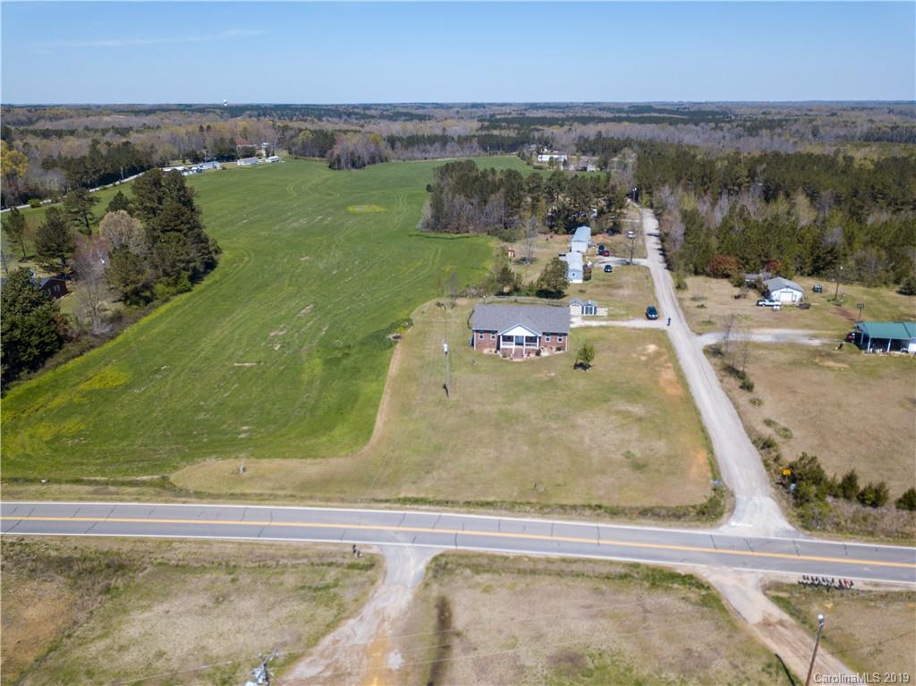 4501 Rowell Road Lancaster, SC 29720 - Photo 36 of 39 an aerial view of a house with a yard and lake view