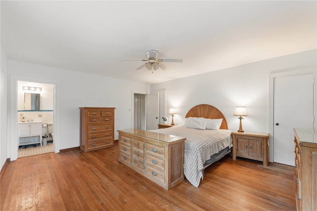 1105 Greenacres Anderson, SC 29621 - Photo 21 of 46 Hardwood floors stretch across this peaceful bedroom, offering a private ensuite bath access.