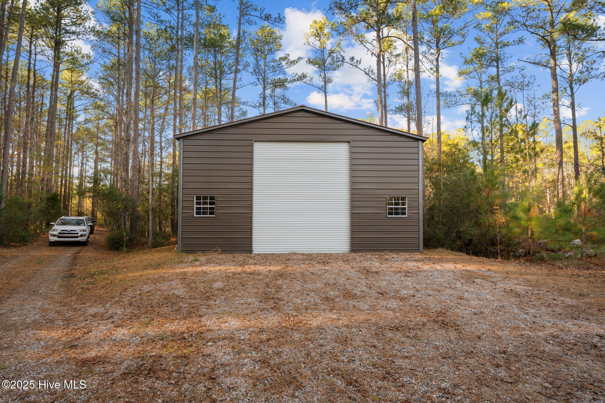 256 Spring Drive Aurora, NC 27806 - Photo 33 of 40 30x60 garage with 14ft garage door - plenty of room for your toys