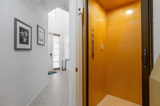a kitchen with granite countertop a refrigerator and a sink