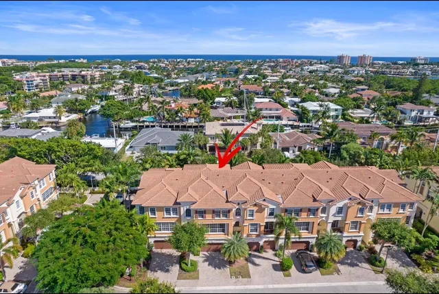 an aerial view of residential houses with outdoor space