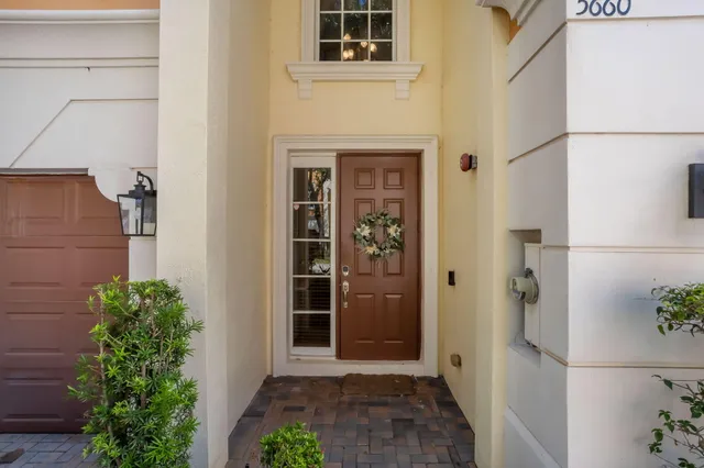 a view of a room that has a bed and a window in it