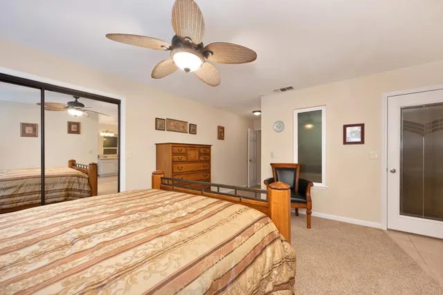 a bedroom with a bed and a closet