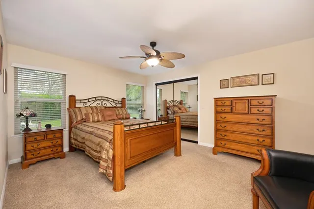 a bathroom with a double vanity sink mirror and shower