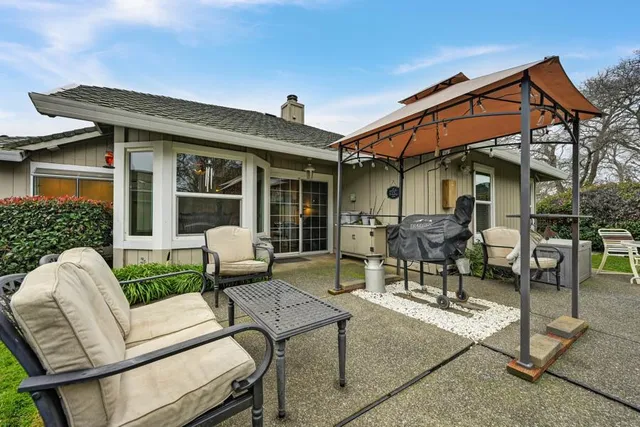 a patio with table and chairs