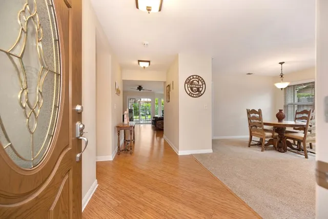 a view of a hallway with seating area