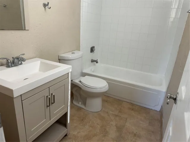 a bathroom with a toilet and a sink