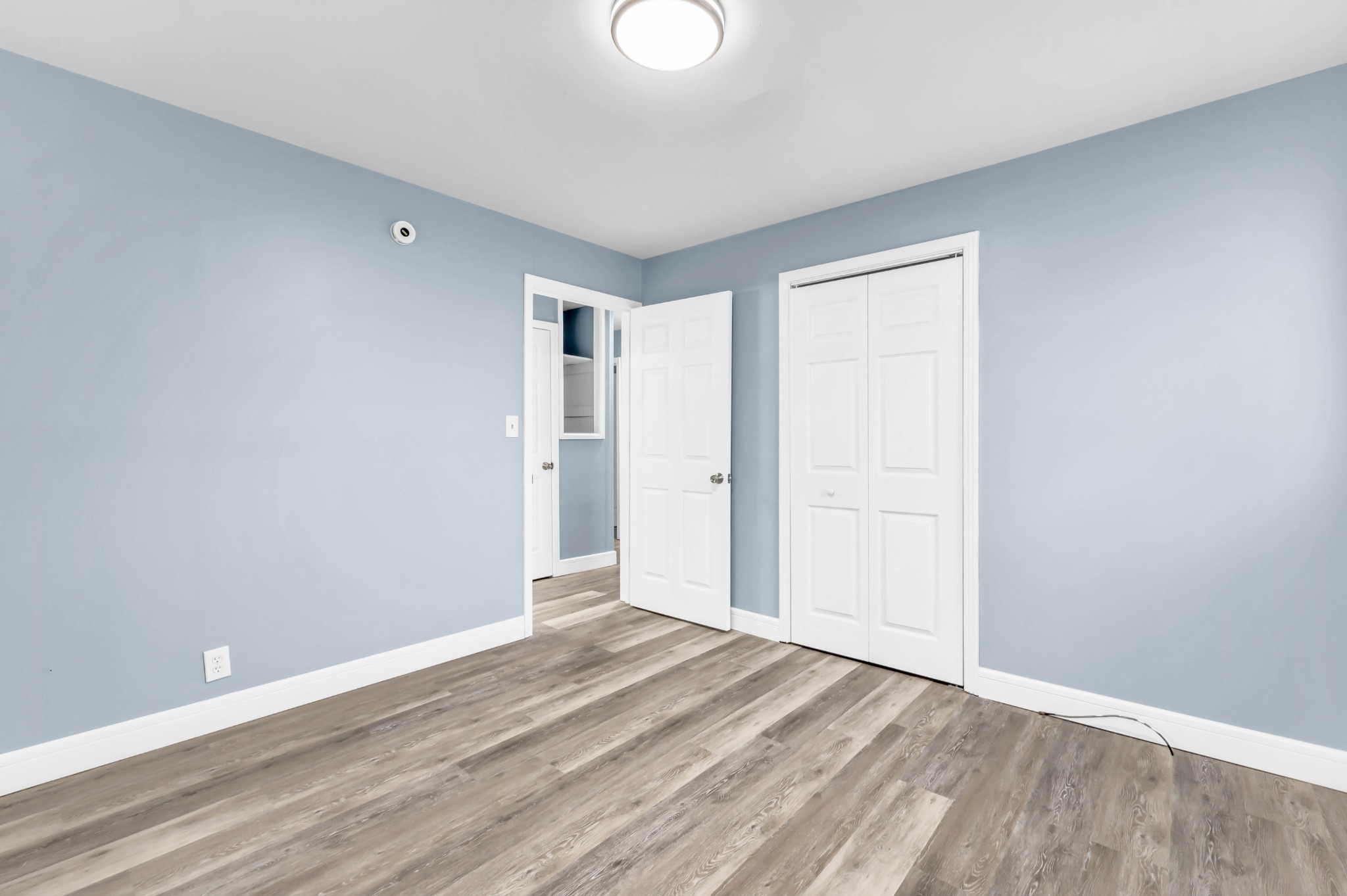 124 Yorktown Road Clarksville, TN 37042 - Photo 16 of 27 a view of an empty room and wooden floor
