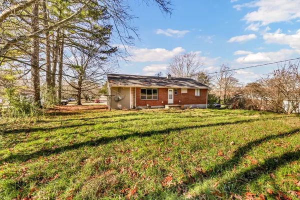 a view of a house with a big yard