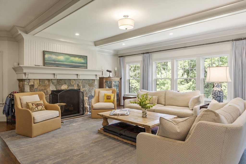 343 Nashawtuc Road Concord, MA 01742 - Photo 11 of 41 a living room with furniture and a fireplace
