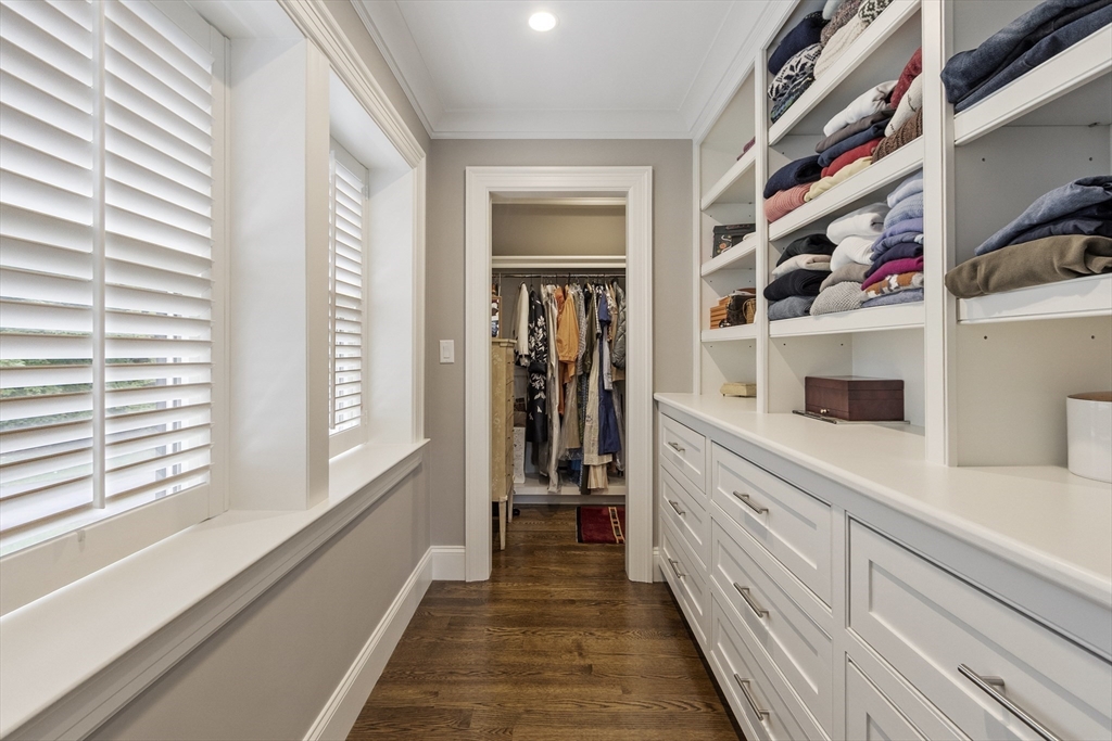 343 Nashawtuc Road Concord, MA 01742 - Photo 21 of 41 a hallway with white cabinets and window
