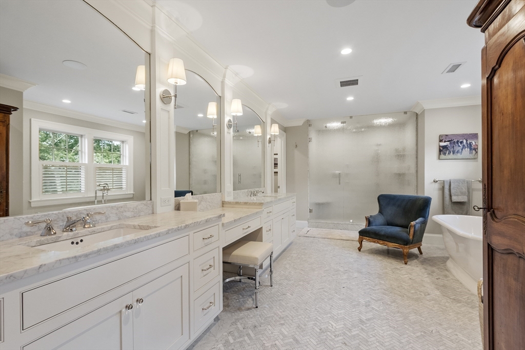 343 Nashawtuc Road Concord, MA 01742 - Photo 22 of 41 a bathroom with a double vanity sink and a mirror