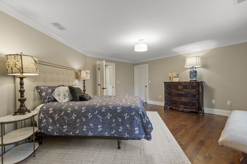343 Nashawtuc Road Concord, MA 01742 - Photo 27 of 41 a bedroom with a bed and a dresser