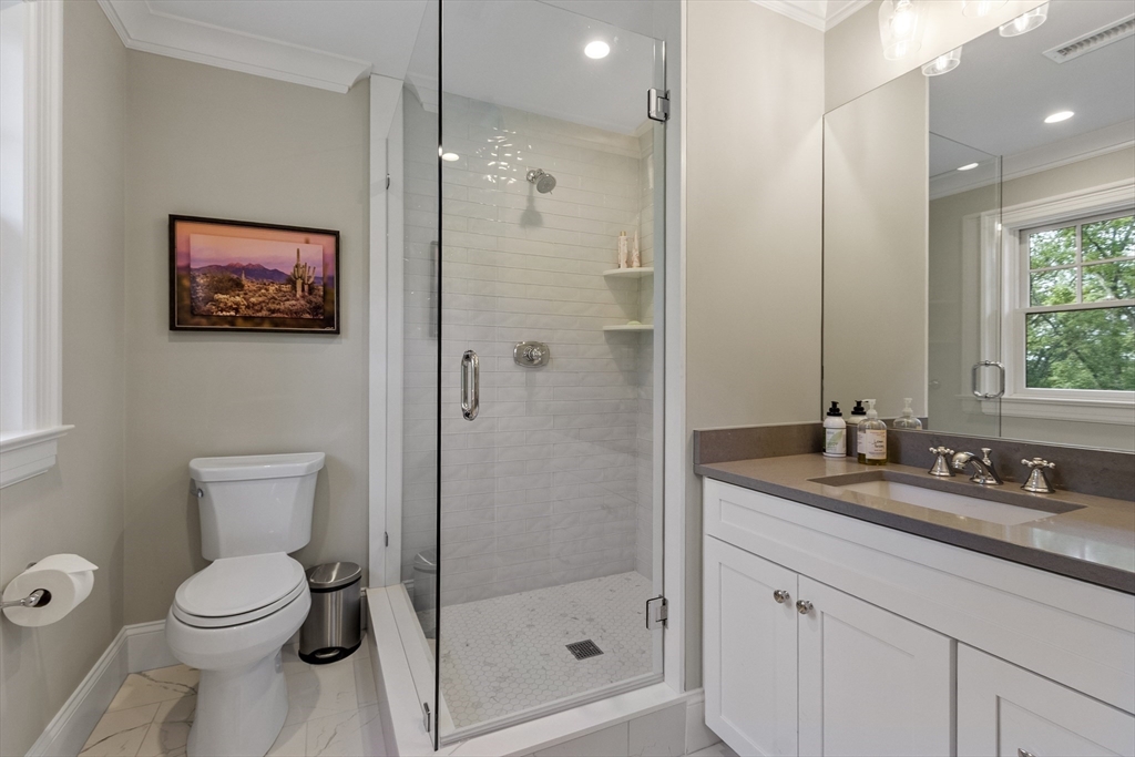 343 Nashawtuc Road Concord, MA 01742 - Photo 28 of 41 a bathroom with a sink a toilet and shower