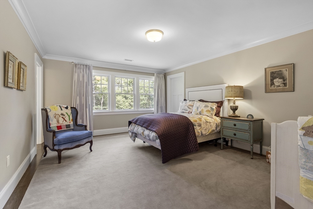 343 Nashawtuc Road Concord, MA 01742 - Photo 33 of 41 a bedroom with a bed and a couch