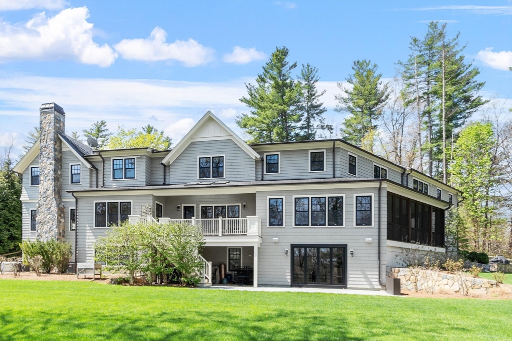 343 Nashawtuc Road Concord, MA 01742 - Photo 38 of 41 a front view of a house with a garden
