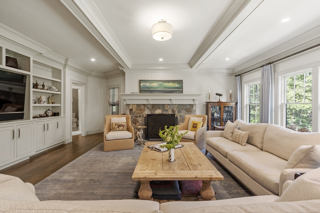 343 Nashawtuc Road Concord, MA 01742 - Photo 5 of 41 a living room with furniture fireplace and flat screen tv
