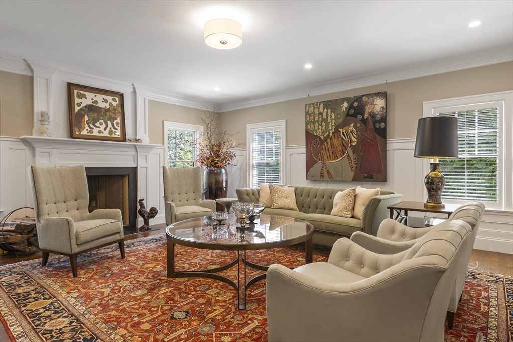 343 Nashawtuc Road Concord, MA 01742 - Photo 10 of 41 a living room with furniture and a fireplace