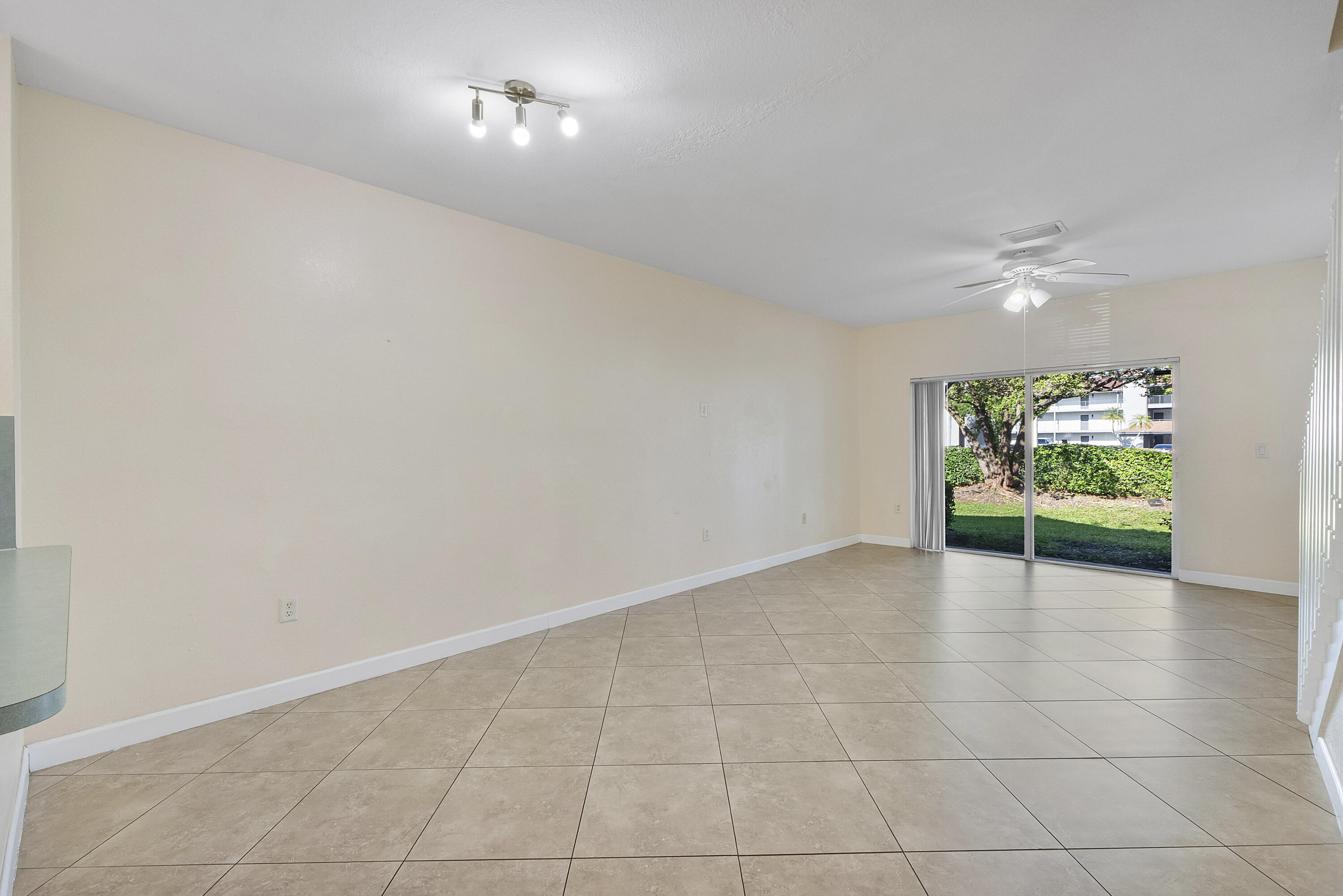 5910 Riverside Avenue Tamarac, FL 33321 - Photo 11 of 47 a view of an empty room with a window