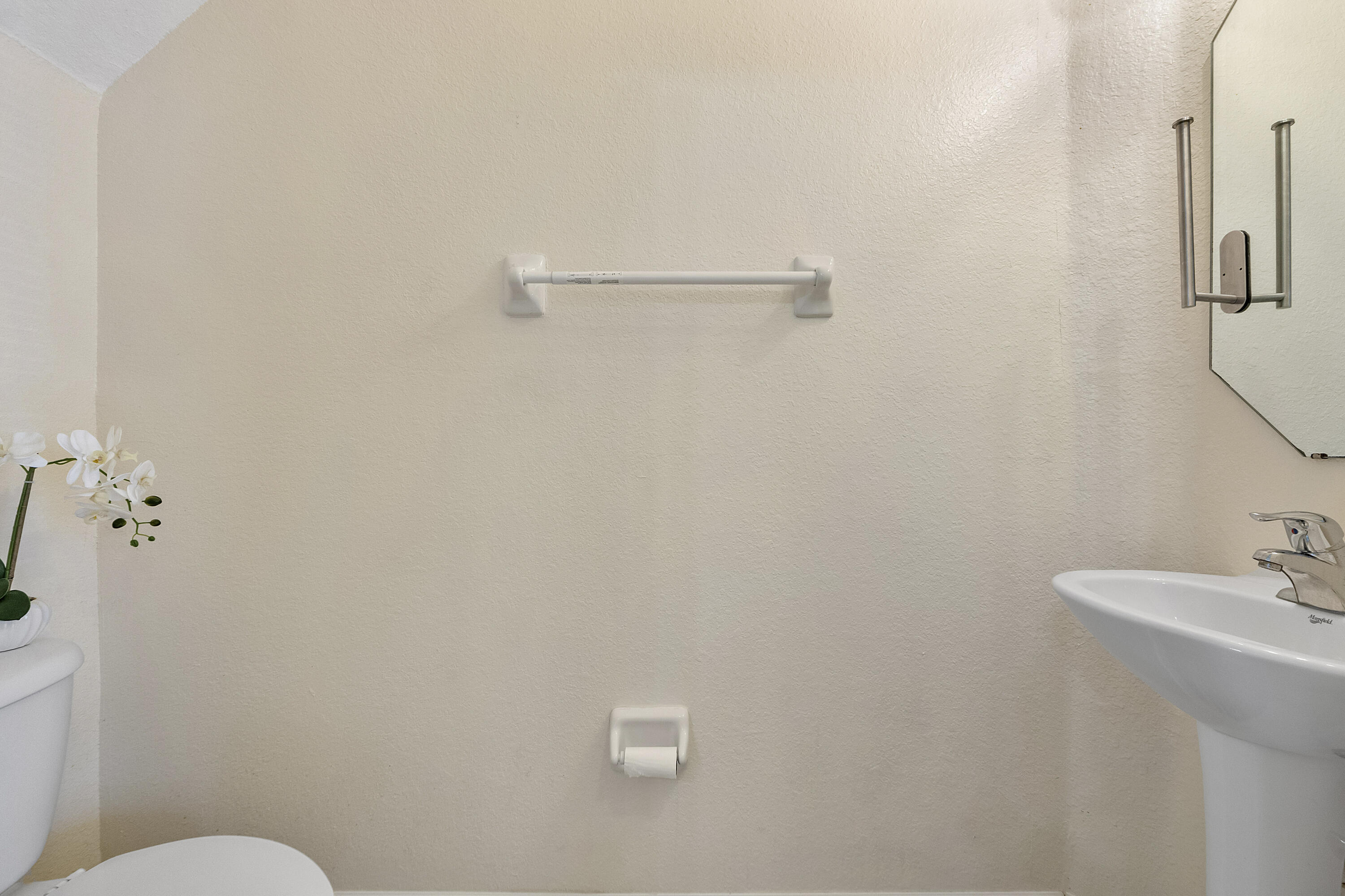 5910 Riverside Avenue Tamarac, FL 33321 - Photo 19 of 47 a bathroom with a sink and mirror