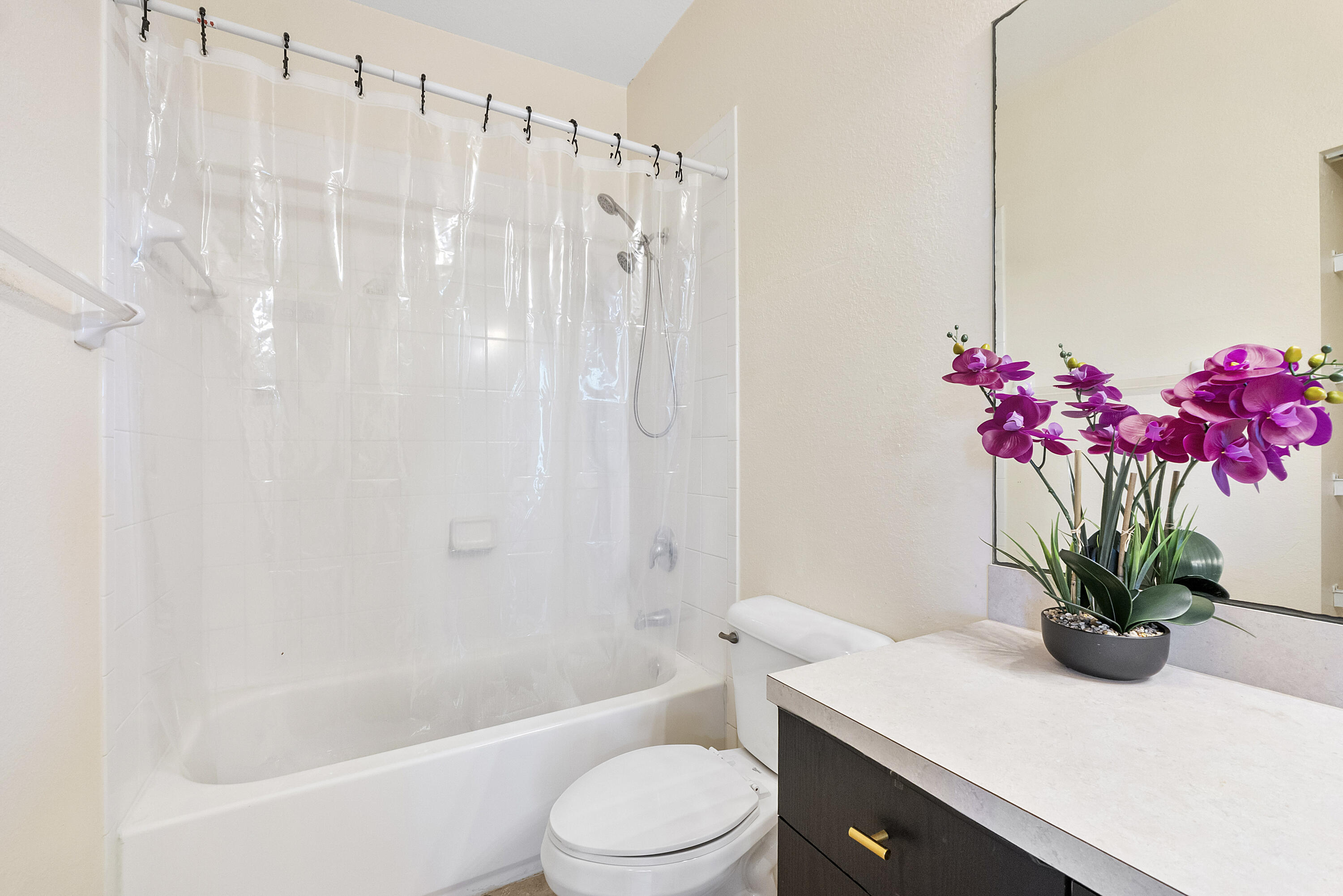 5910 Riverside Avenue Tamarac, FL 33321 - Photo 23 of 47 a bathroom with a sink a toilet and shower