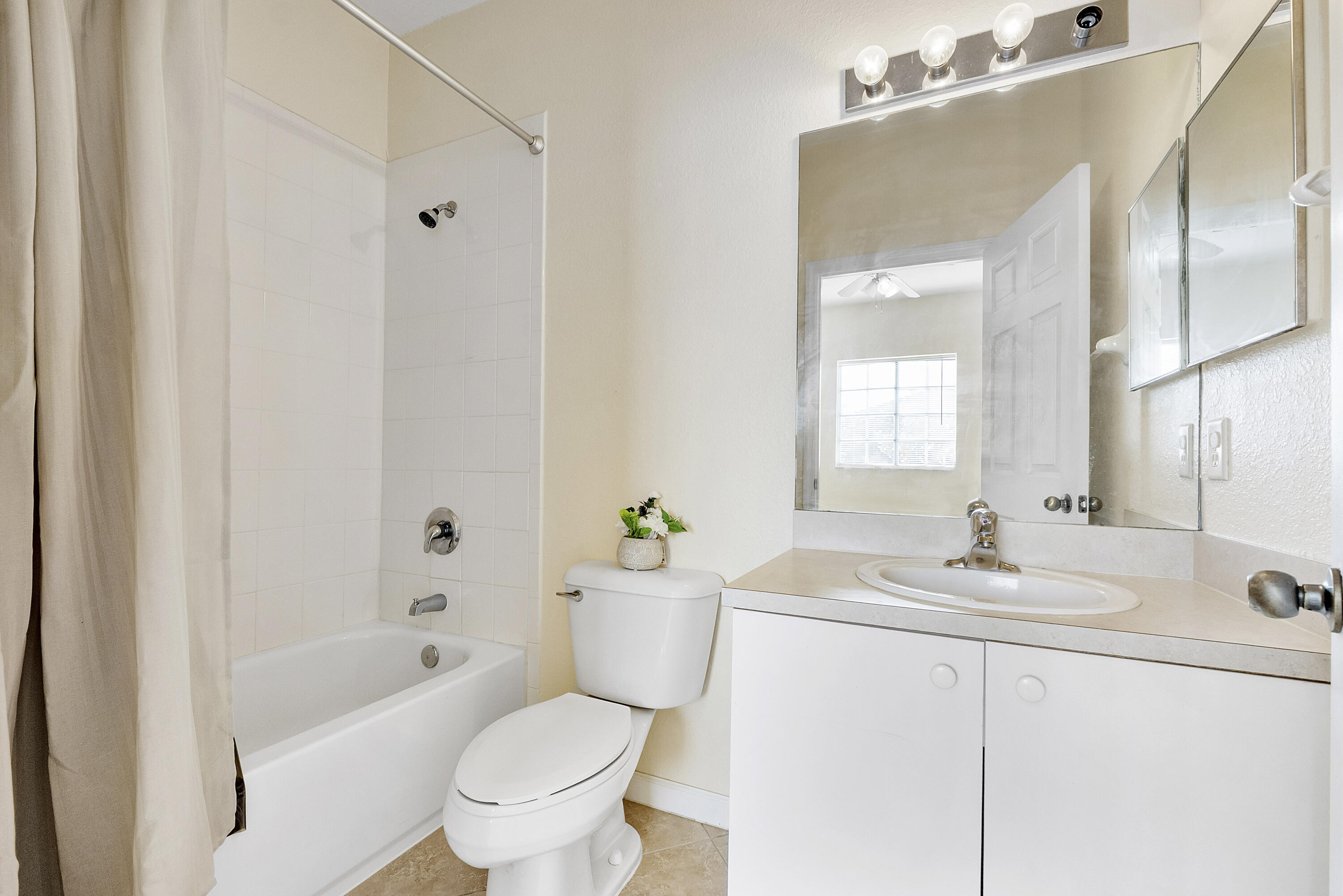 5910 Riverside Avenue Tamarac, FL 33321 - Photo 25 of 47 a bathroom with a sink toilet and shower