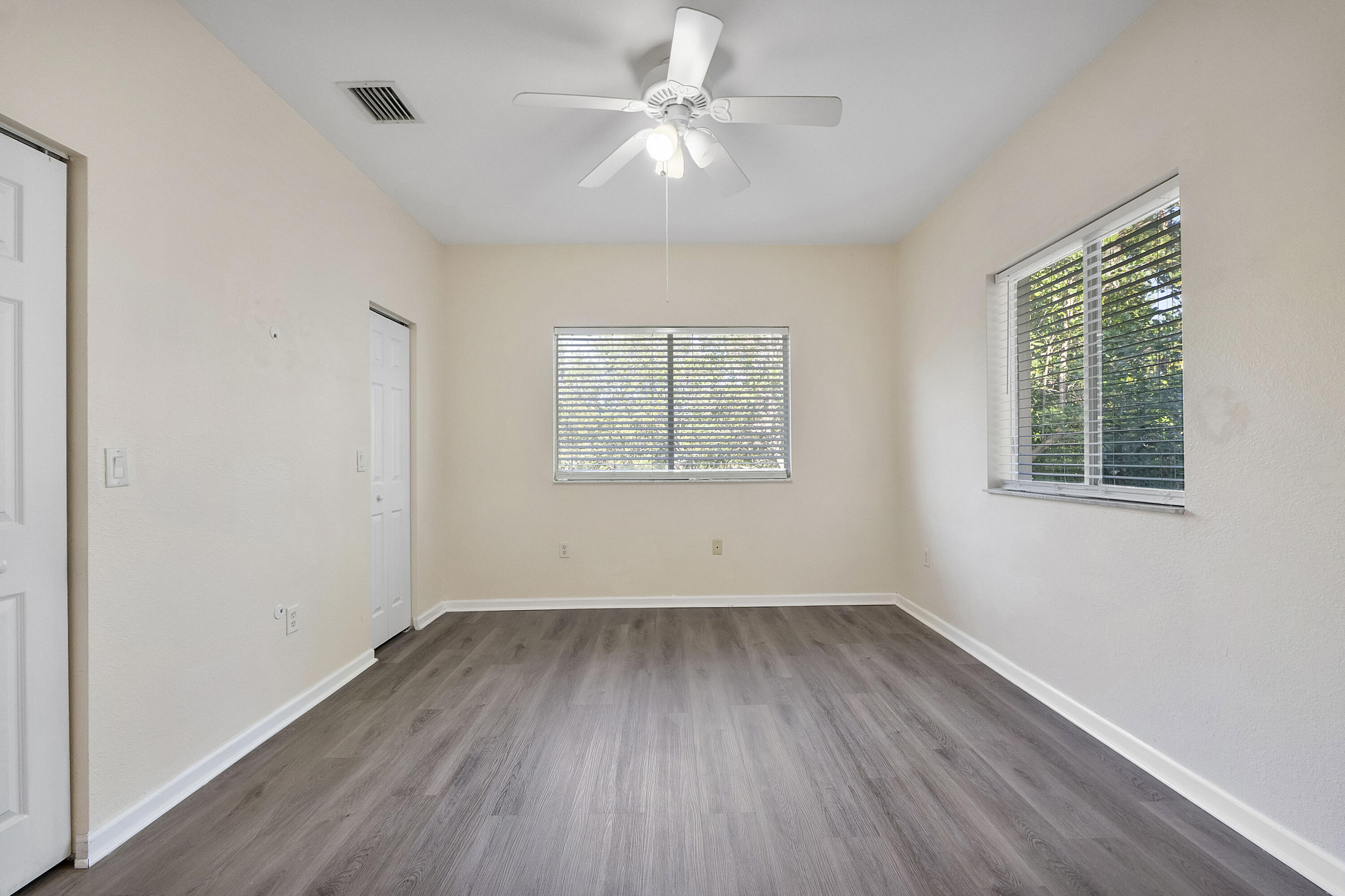 5910 Riverside Avenue Tamarac, FL 33321 - Photo 26 of 47 wooden floor in an empty room with a window