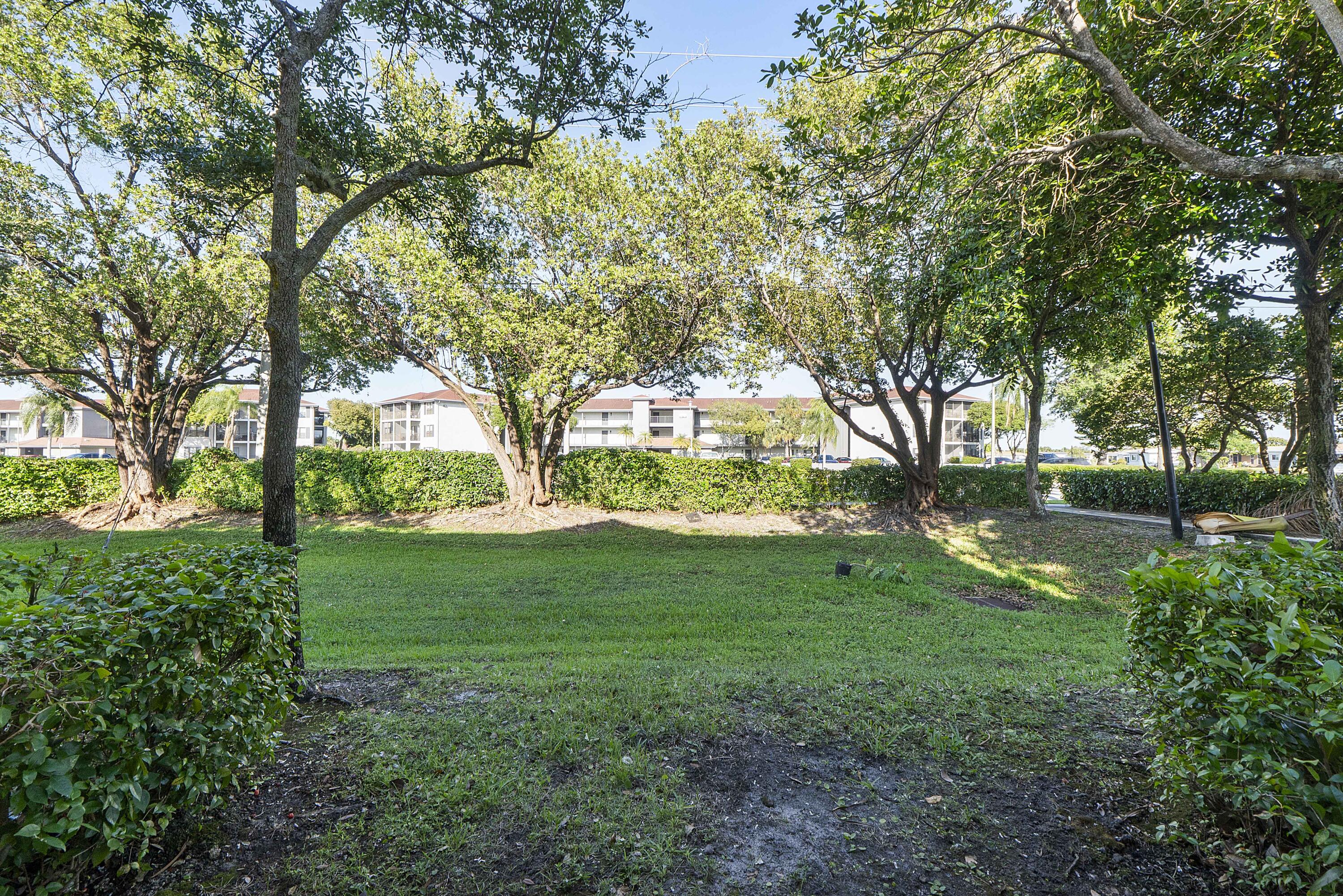 5910 Riverside Avenue Tamarac, FL 33321 - Photo 31 of 47 a view of yard with trees