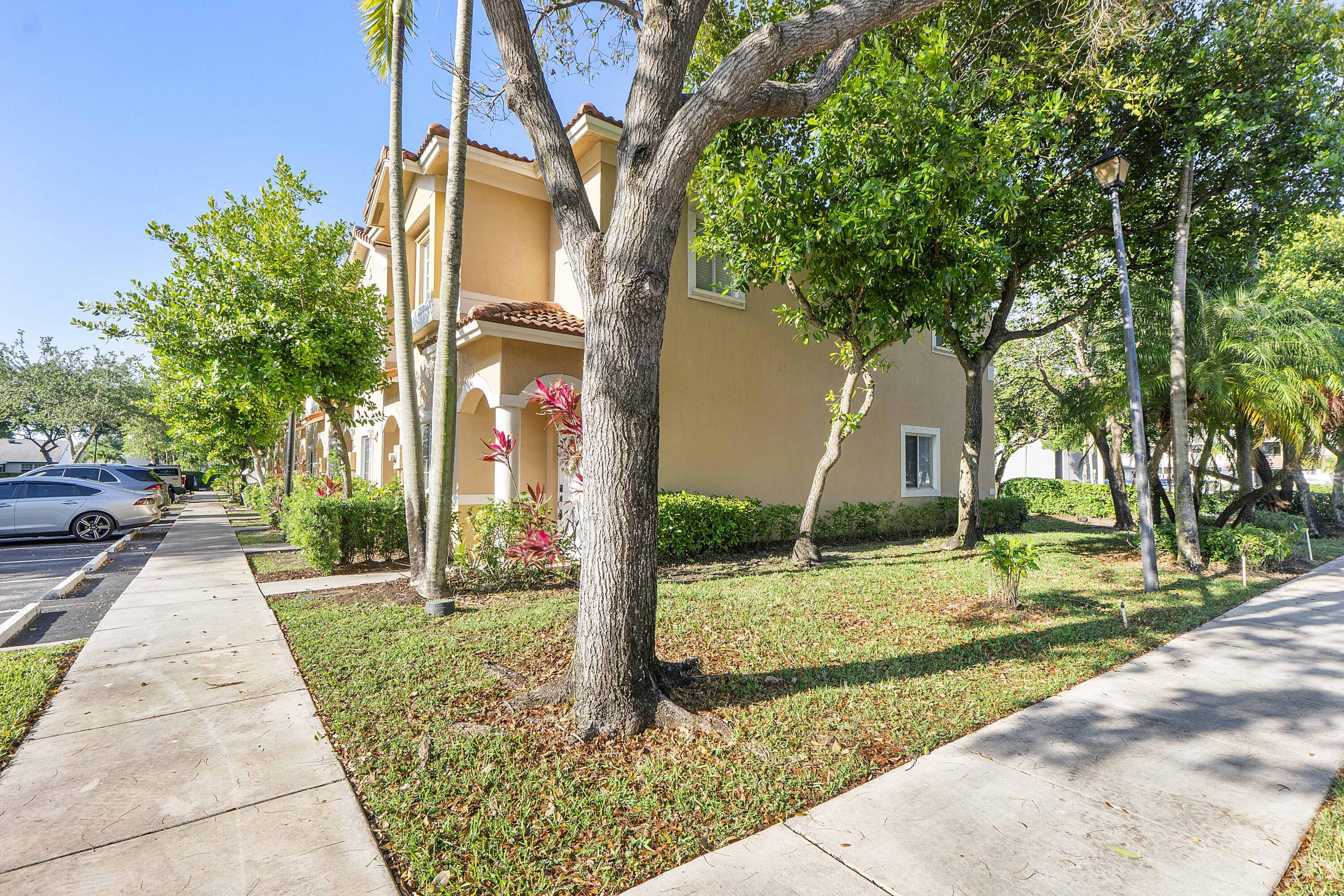 5910 Riverside Avenue Tamarac, FL 33321 - Photo 38 of 47 a pathway of a house with a yard