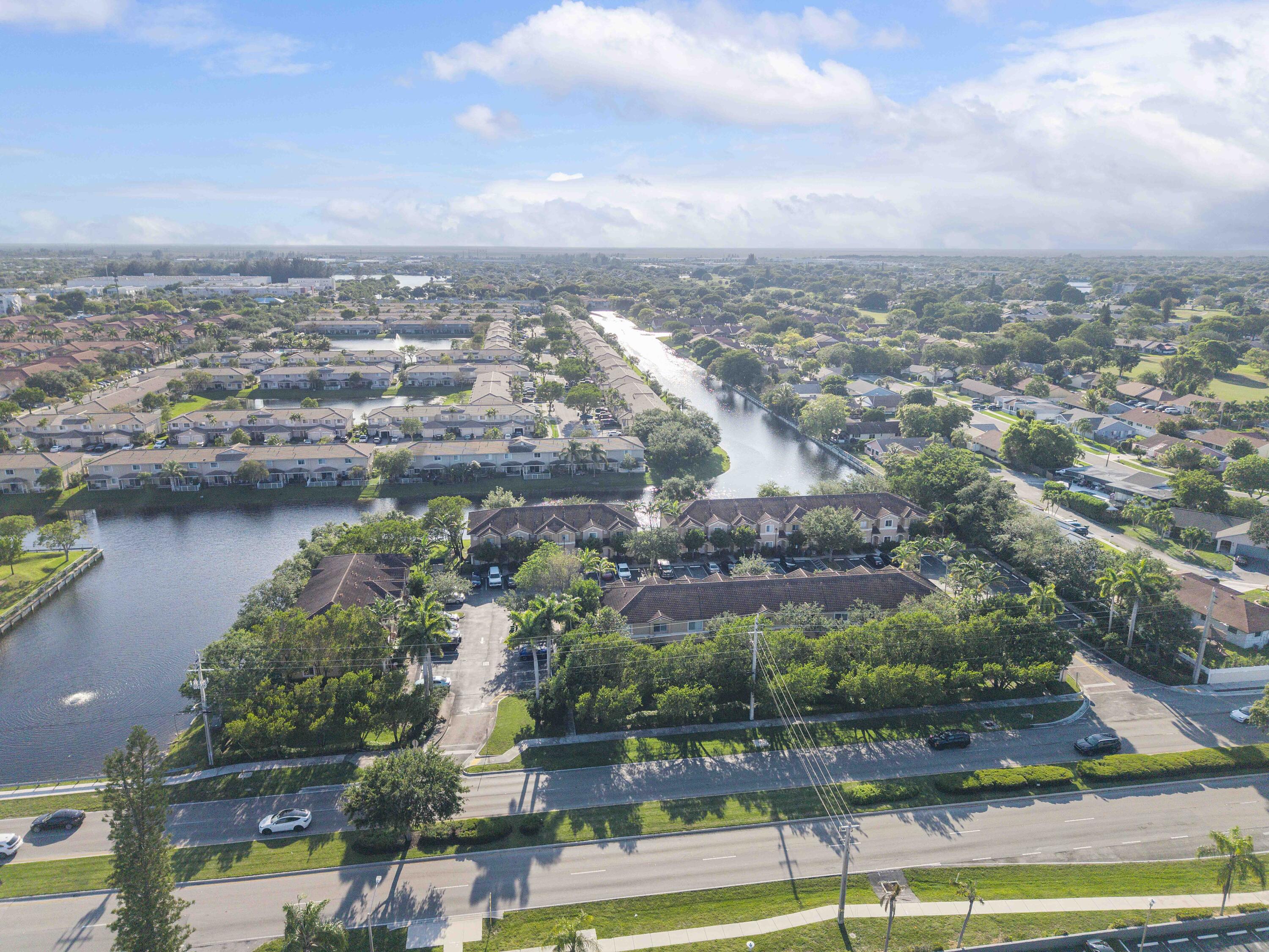 5910 Riverside Avenue Tamarac, FL 33321 - Photo 43 of 47 an aerial view of residential building with lake view and boat