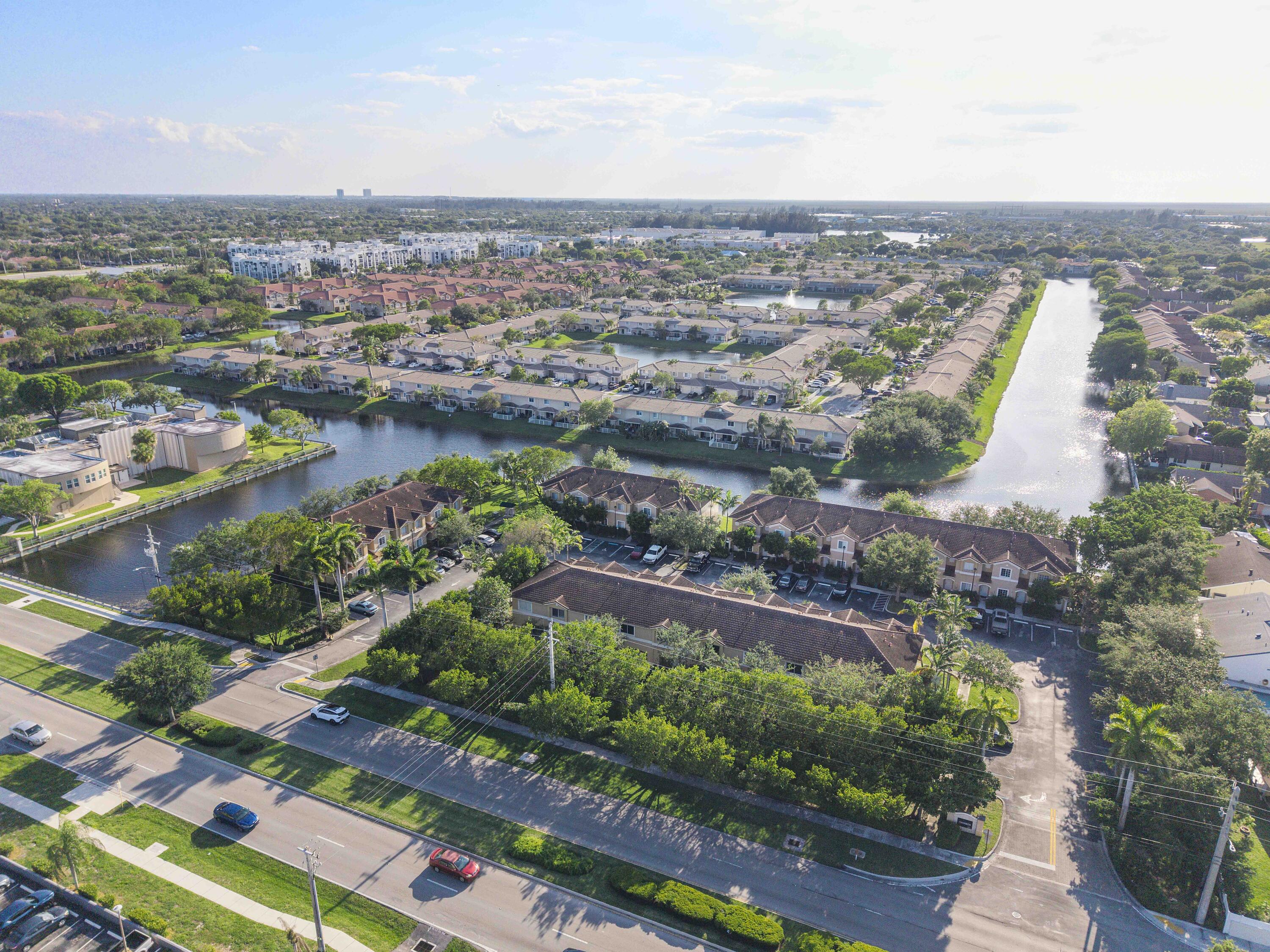 5910 Riverside Avenue Tamarac, FL 33321 - Photo 45 of 47 an aerial view of a city with lots of residential buildings ocean and mountain view in back