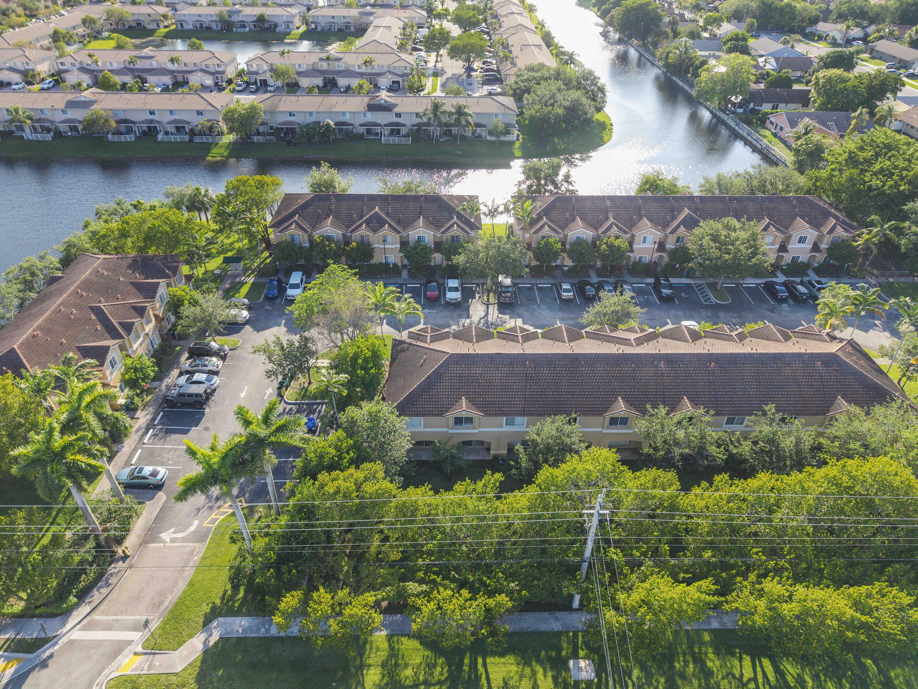 5910 Riverside Avenue Tamarac, FL 33321 - Photo 46 of 47 an aerial view of lake and residential houses with outdoor space