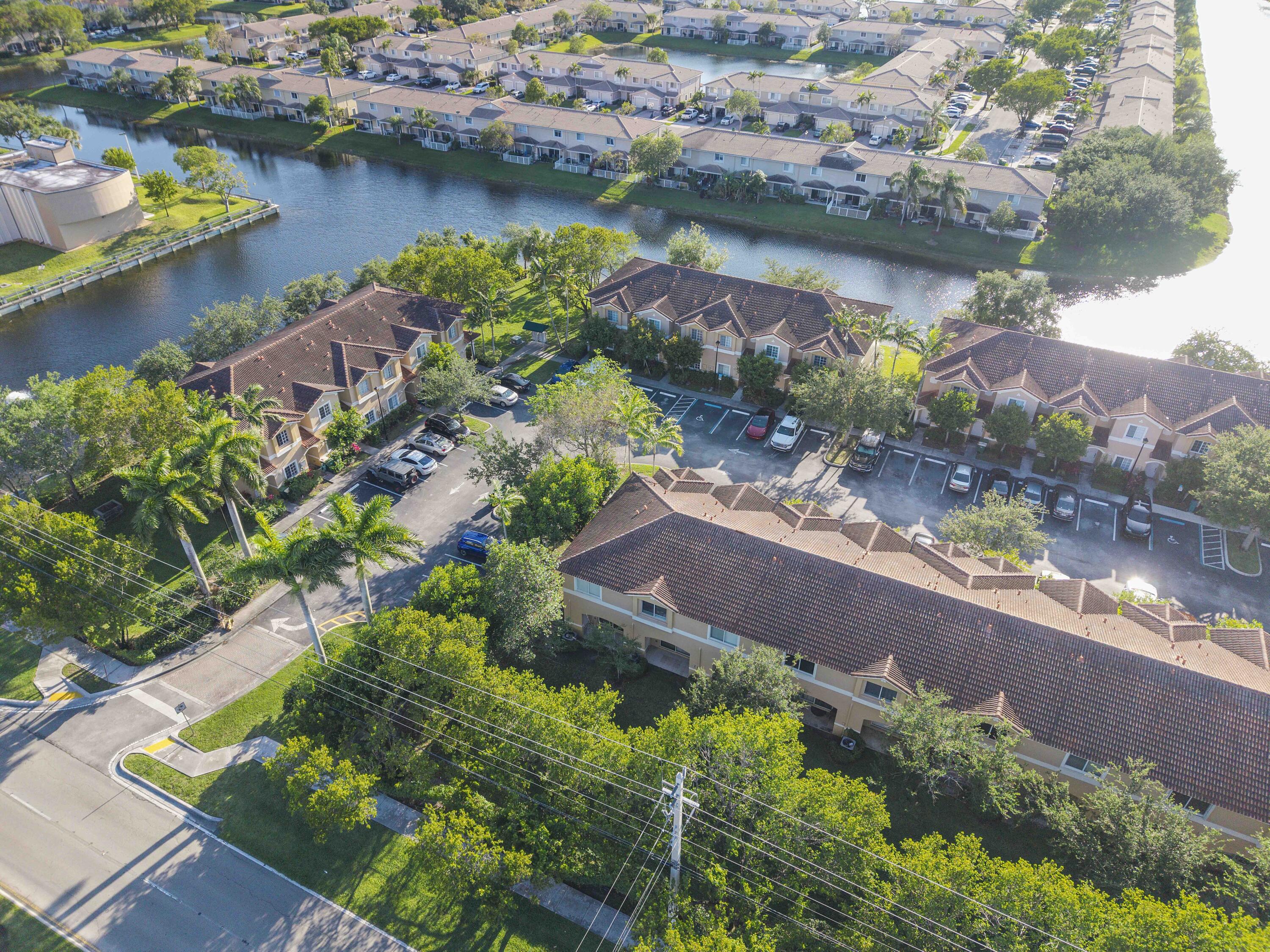 5910 Riverside Avenue Tamarac, FL 33321 - Photo 47 of 47 an aerial view of a house with a lake view