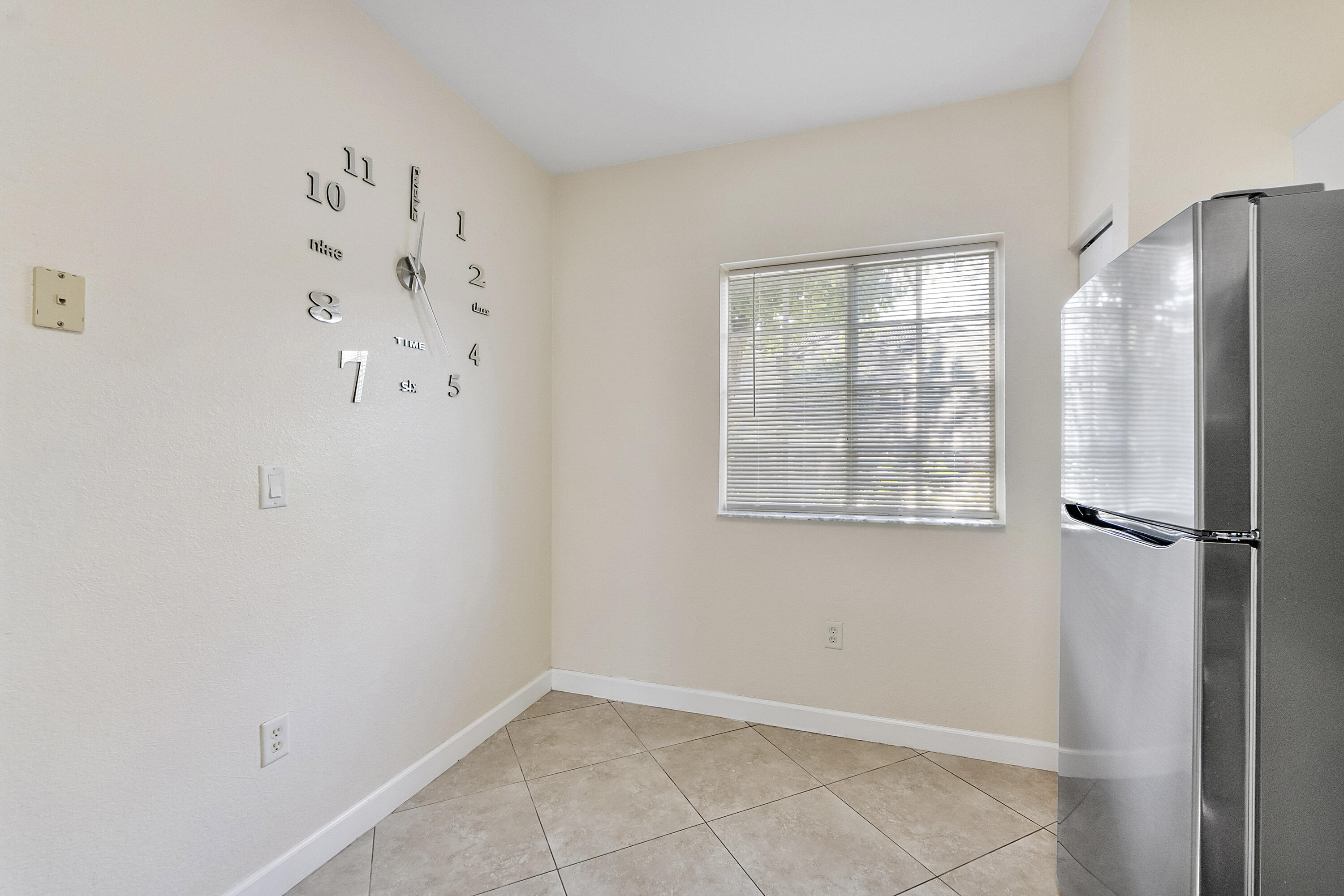 5910 Riverside Avenue Tamarac, FL 33321 - Photo 8 of 47 a view of kitchen with hardwood floor and window