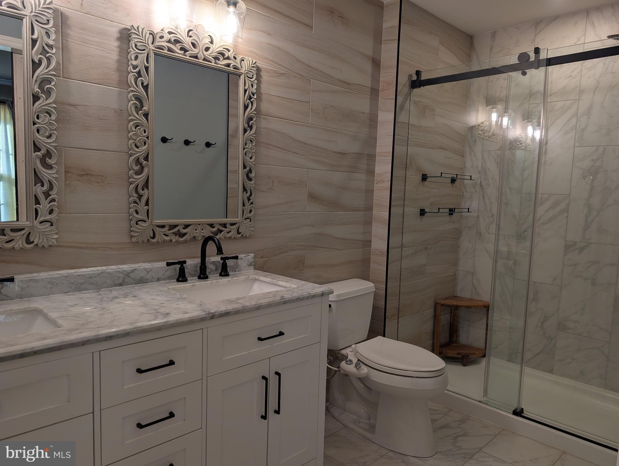 18 Kings Bridge Court Newark, DE 19702 - Photo 23 of 38 a bathroom with a granite countertop sink toilet and shower
