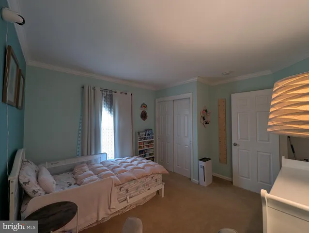 a view of an empty room and wooden floor