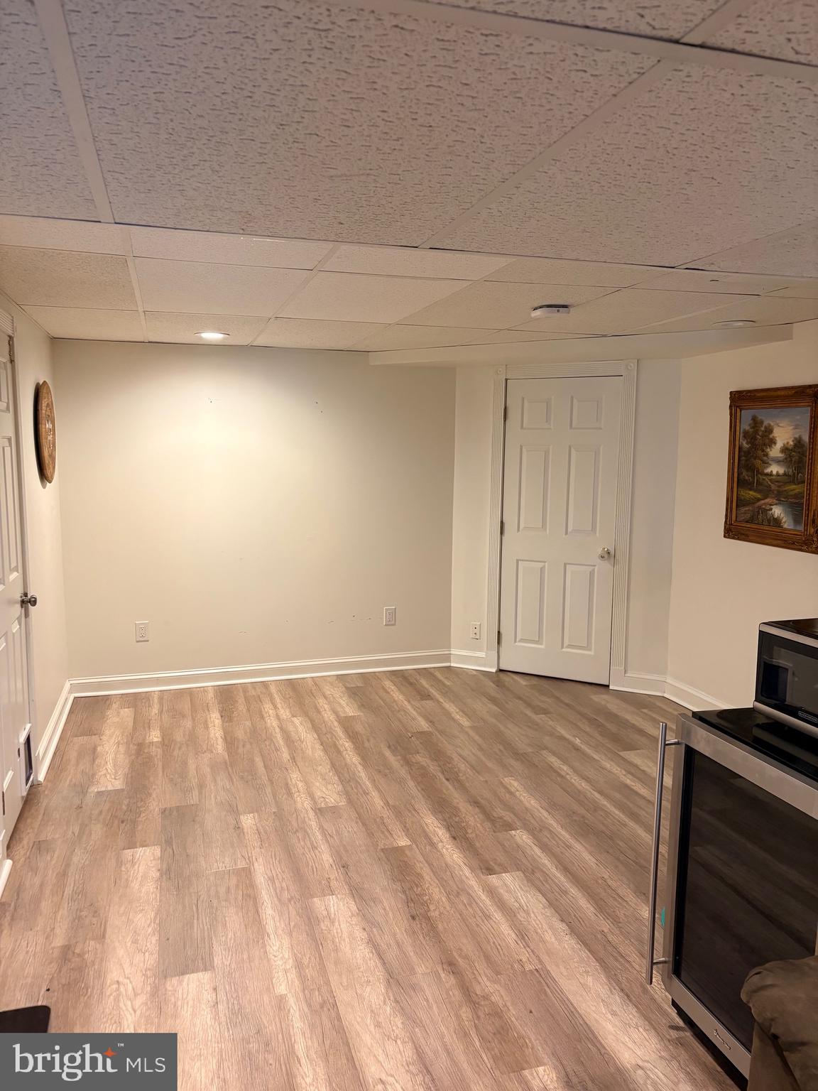 18 Kings Bridge Court Newark, DE 19702 - Photo 29 of 38 a view of an empty room and wooden floor