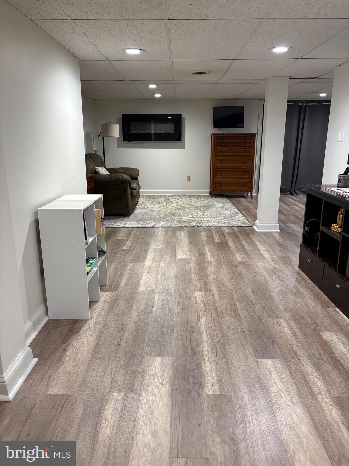 18 Kings Bridge Court Newark, DE 19702 - Photo 31 of 38 a view of a kitchen with kitchen island wooden floors and living room