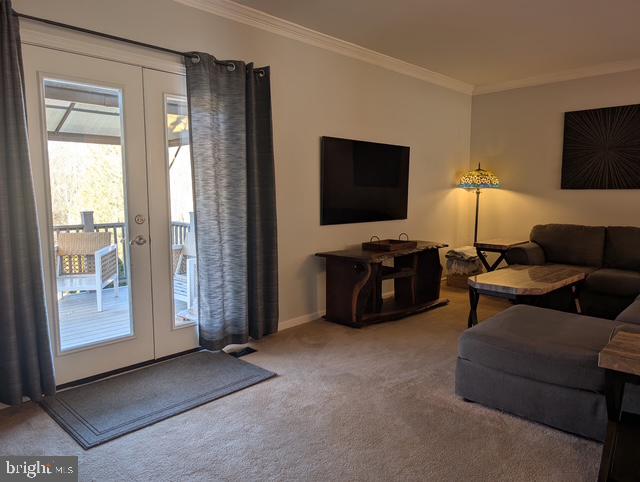 18 Kings Bridge Court Newark, DE 19702 - Photo 8 of 38 a living room with furniture and a flat screen tv