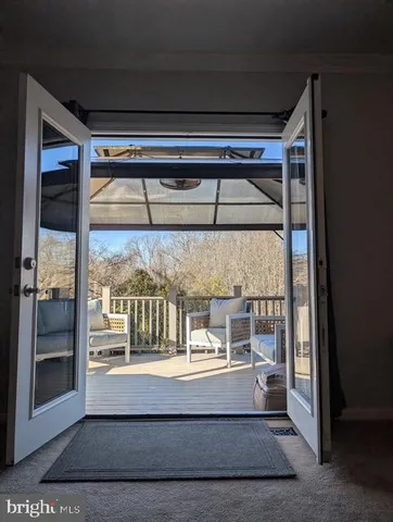 a dining room with furniture and chandelier