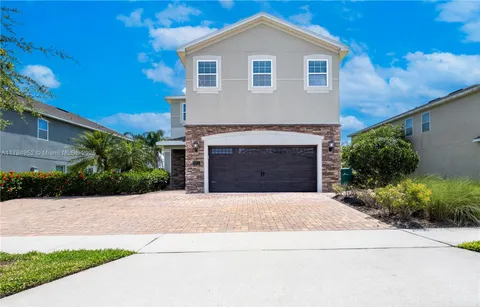 a front view of a house with yard